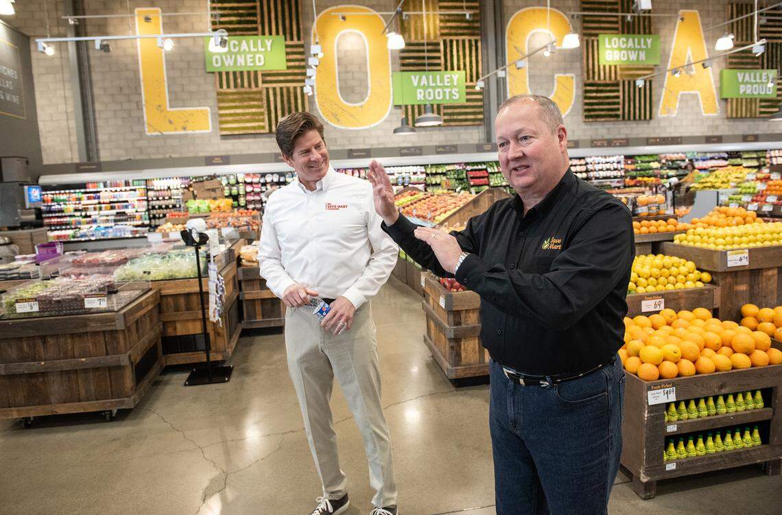 Executive Chairman Shane Sampson, right, and and CEO Chris McGarry, left, give the Bee at tour of the Save Mart supermarket on Oakdale Road in Modesto, Calif., on Wednesday, April 6, 2022.