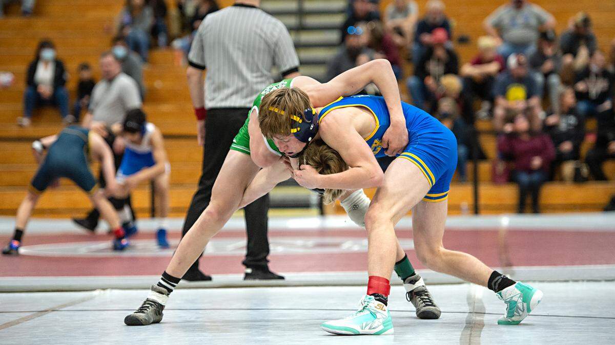 106-pound wrestlers Turlock’s Ethan Ward and Kyle Holtberg of St. Mary’s grapple during the CIF Sac-Joaquin Section Wresting Team Duals Championships at Natomas High School in Sacramento, Calif., on Saturday, Jan. 29, 2022.