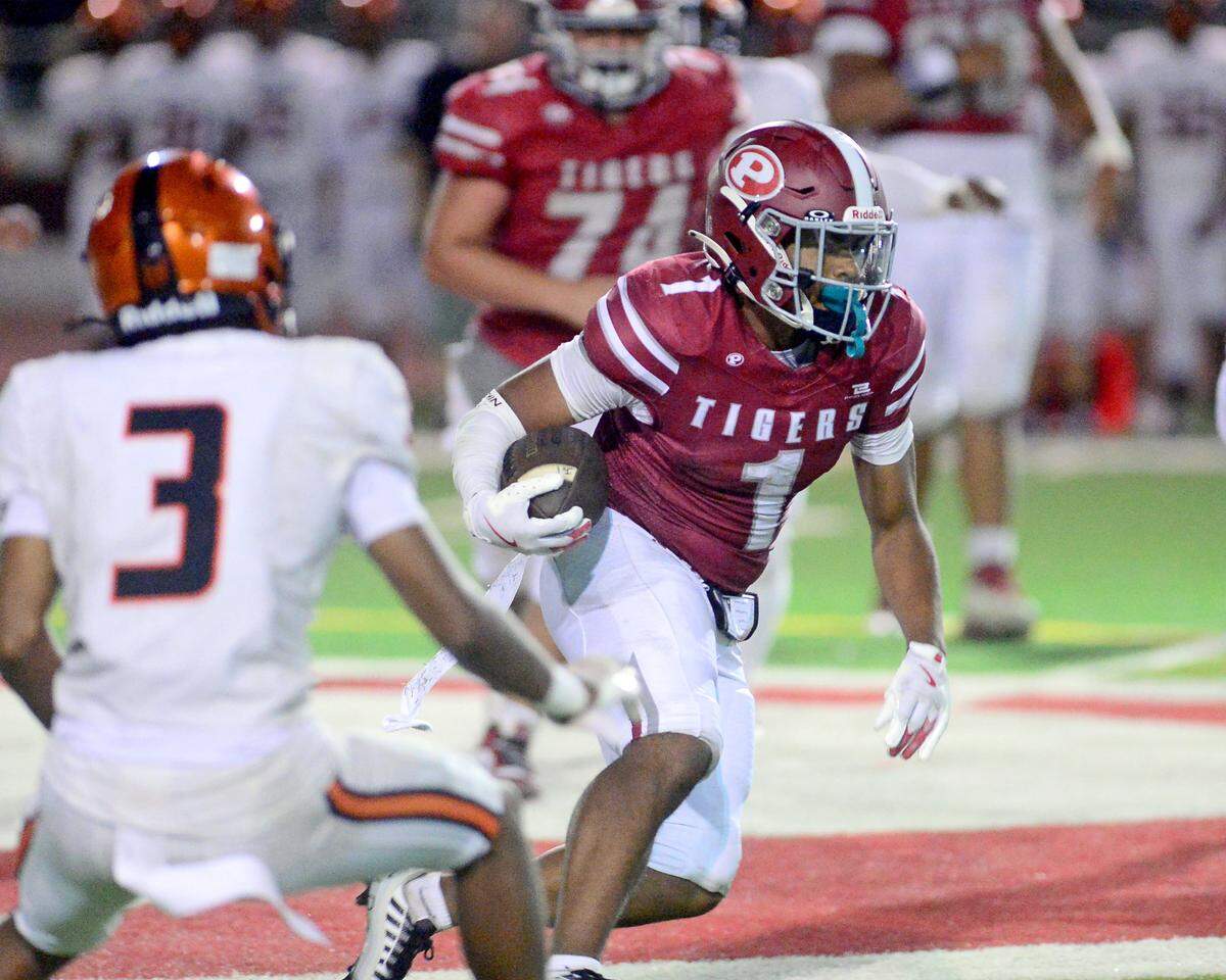 Patterson running back Jeremiah Lugo (1) cuts upfield during a game between Patterson High School and Merced High School at Patterson High on Aug. 23, 2024.