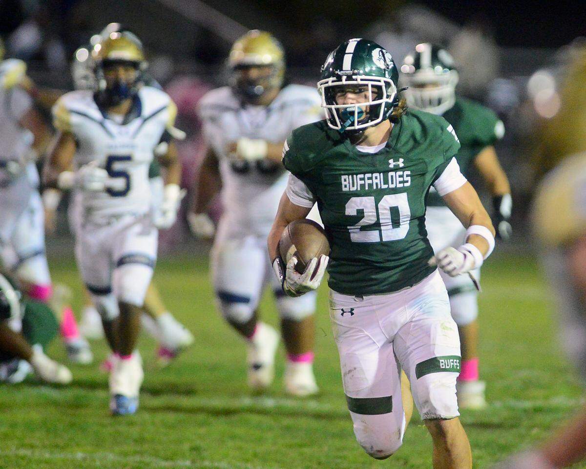 Manteca running back Blake Nichelson breaks free during a game between Central Catholic High School and Manteca High School in Manteca California on October 22, 2022. Central Catholic won the game 56-49.