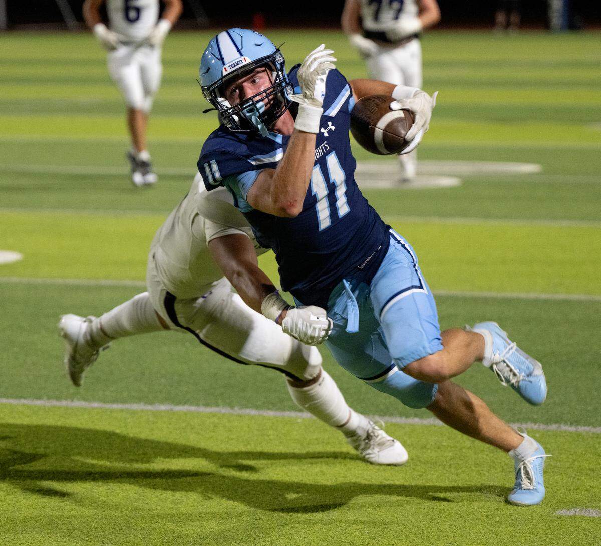 Downey’s Ethan Woodmansee runs the ball after a reception during the game with Amador Valley at Downey High School in Modesto, Calif., Friday, Sept. 13, 2024.