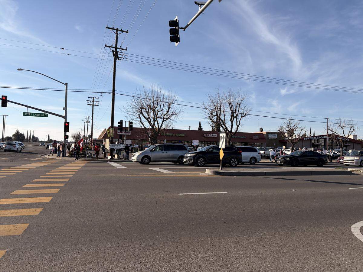 Protesters at the anti-ICE rally at the intersection of Hatch and Crows Landing roads in south Modesto on Saturday, Jan. 10, 2026.