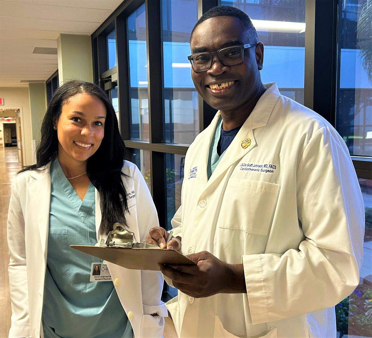 Dr. John deGraft-Johnson, right, with cardiothoracic surgery resident Devon Anderson.