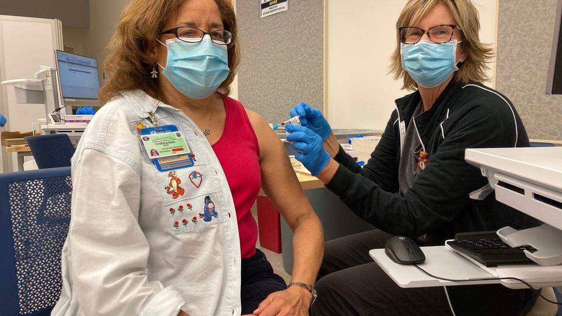 ChrisAnna Mink, Los Angeles physician and former Modesto Bee reporter, practices what she preaches. Here she receives a vaccination in December 2020.