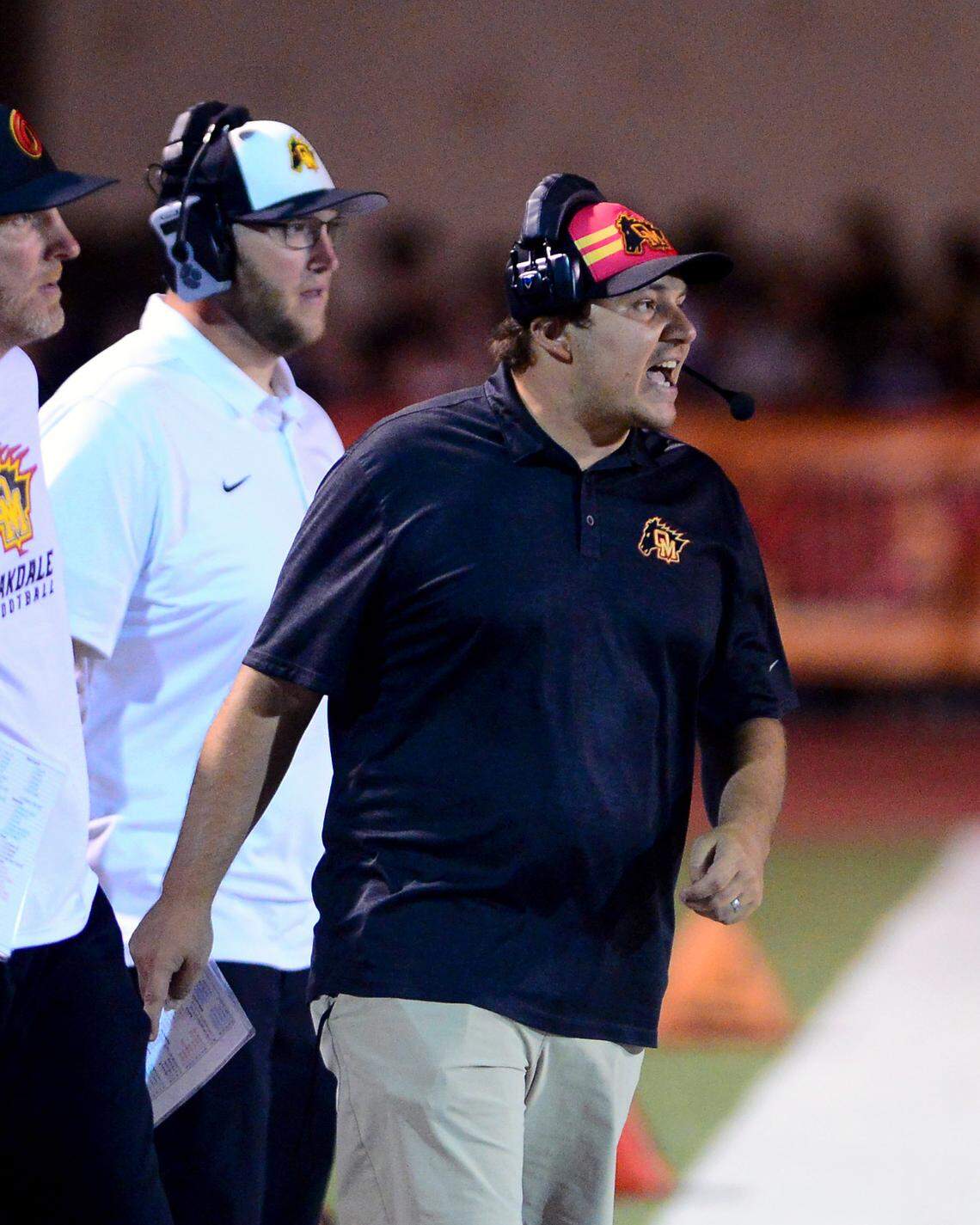 Oakdale coach Garrett Martin yells to his players on the field during a game between Oakdale and Escalon at Oakdale High School in Oakdale, California, on September 15, 2023.