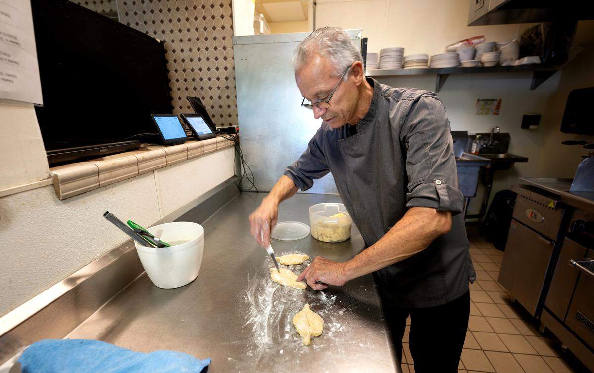 Chef Abel Cano prepares corn bread at Cariblue restaurant in Modesto, Monday, Oct. 14, 2024.