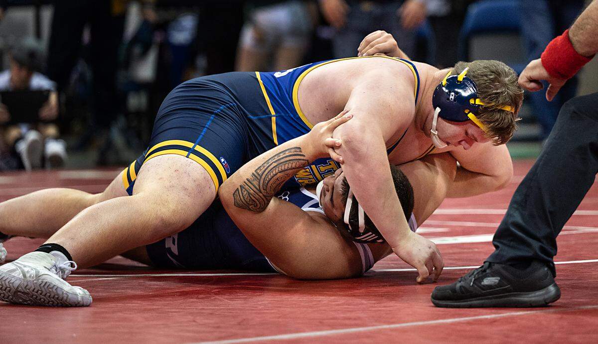 Ashton Patterson of Turlock claimed seventh place with a pin of Casa Roble wrestler Ben Gumpfer in the 285-pound match during the CIF Sac-Joaquin Section Masters Wrestling Tournament at the Stockton Arena in Stockton, Calif., on Saturday, Feb. 19, 2022.