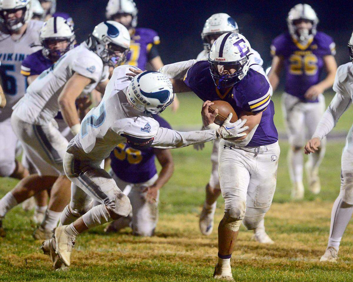 Escalon running back Ryker Peters fights off a defender during the 2022 CIF NorCal Division 4-AA Bowl Game between Escalon High School and Pleasant Valley High School at Escalon High School in Escalon, Calif. on December 2, 2022. Escalon won the game 42-20.