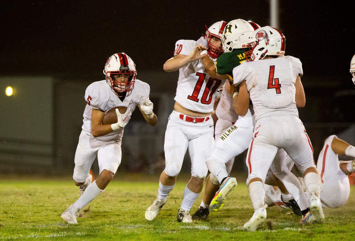Xzavier Clark, 5, of Ripon High works his way around the line on his way up field. Ripon vs Hilmar at Hilmar Sept. 23, 2022.