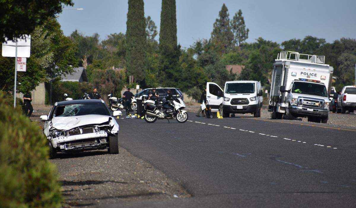 The driver of the white car in the foreground struck a pedestrian on Briggsmore Avenue east of Roselle Avenue early Thursday, May 5, 2022, according to Modesto police. The pedestrian died at the scene.