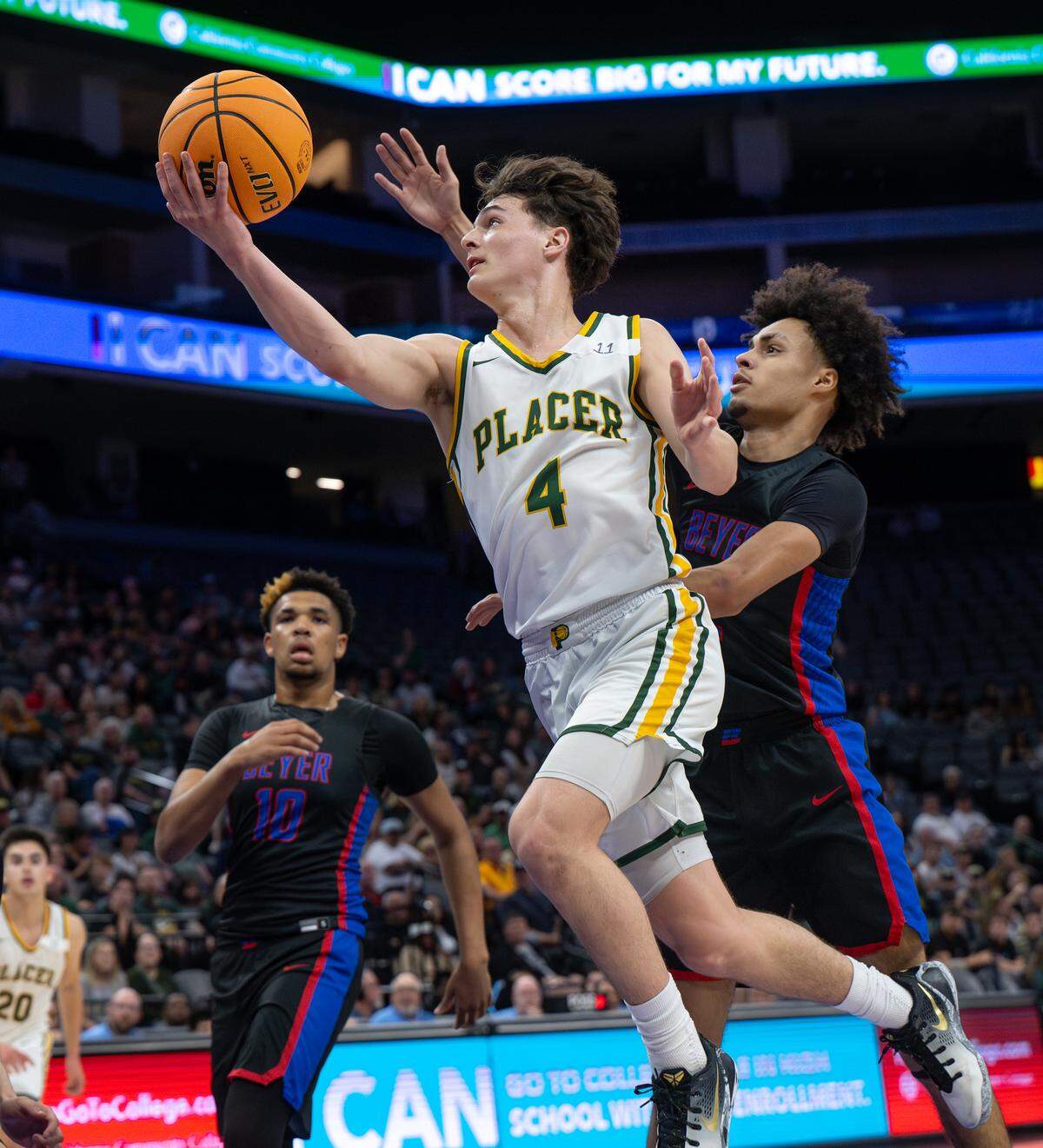 Placer’s Kannon Rector scores past Beyer’s Rodney Oliney during the Sac-Joaquin Section Division III championship game at the Golden 1 Center in Sacramento.
