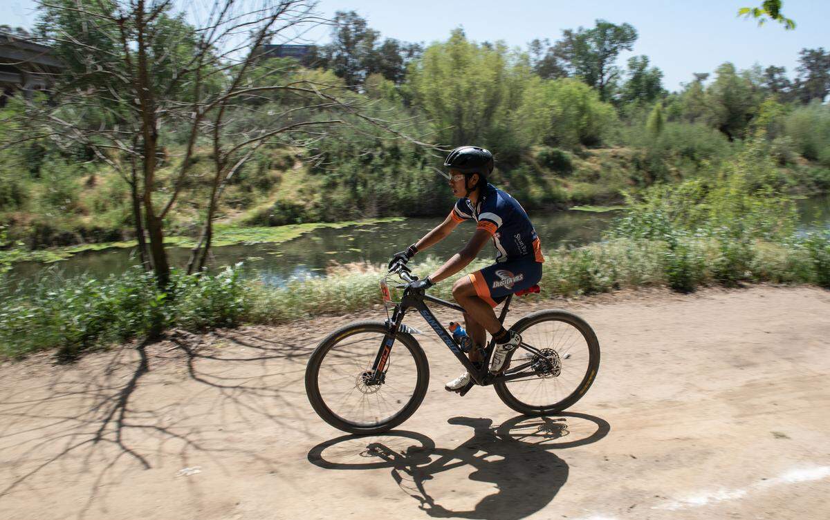 Modesto Composite team member Emiliano Contreras competes in the JV boys division II race at Tuolumne River Regional Park during the NorCal Interscholastic Cycling League event in Modesto on April 9, 2022. 