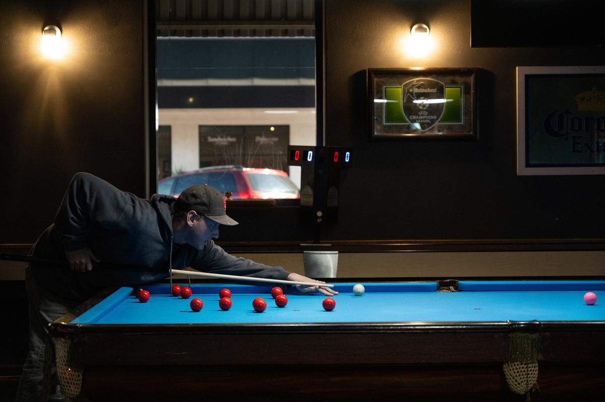 Justin Diaz plays snooker at The Goat Bar & Grill on 10th Street in Modesto, Calif., Thursday, Oct. 26, 2023.