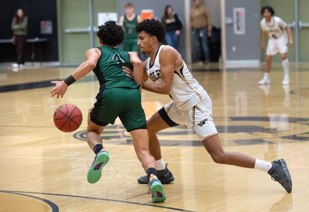 Enochs’ Kevin King steals the ball from Pitman’s Justin Anderson during the Central California Athletic League game at Enochs High School in Modesto, Calif., Friday, Feb. 10, 2023.