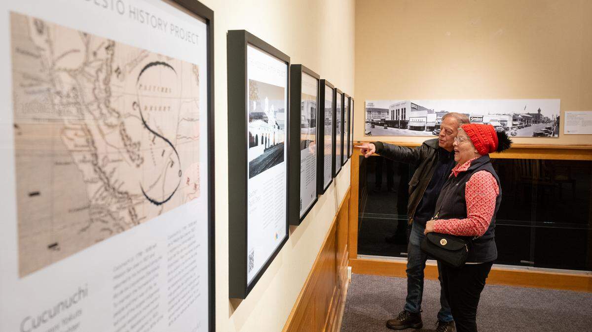 Yolanda Rivera and Doug Derrick look at the Modesto History Project III exhibit at the McHenry Museum in Modesto, Calif., Friday, Feb. 16, 2024.