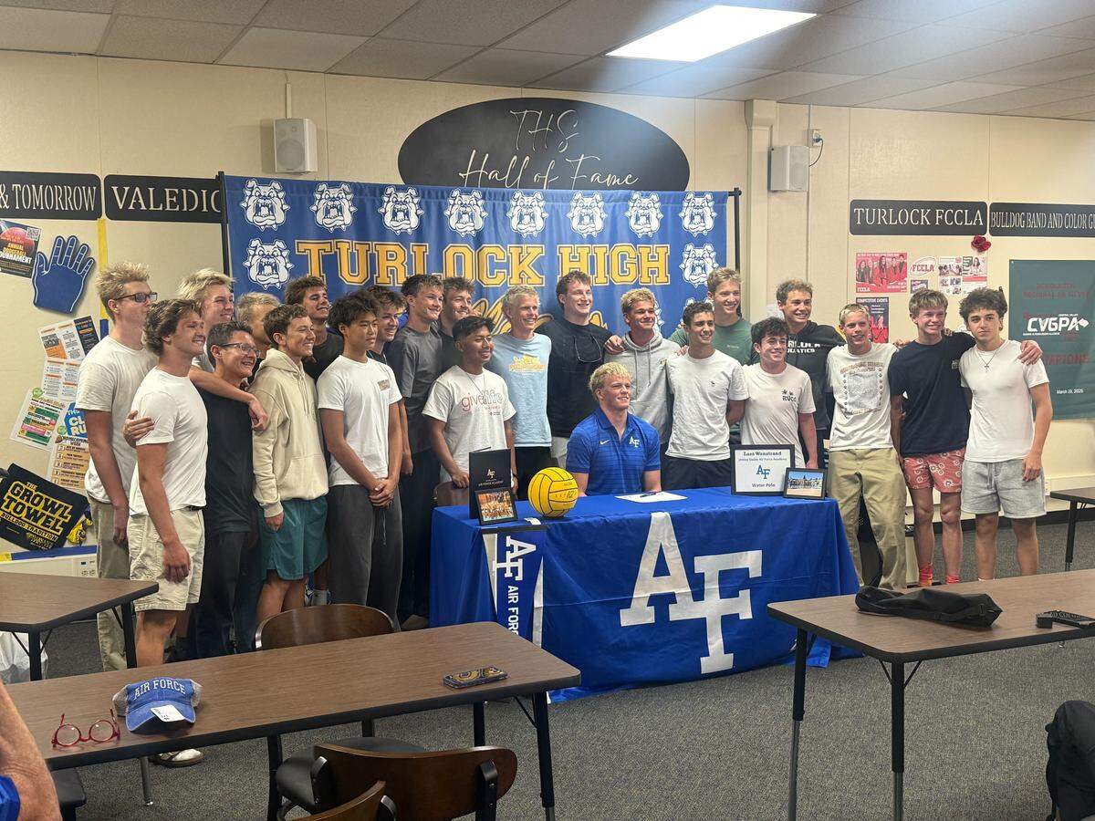 Turlock High water polo player Lars Wenstrand takes a picture with teammates at his signing ceremony. Wenstrand signed to attend the Air Force Academy where he will compete at the Division I level at Turlock High School, Thursday, March 26, 2026.