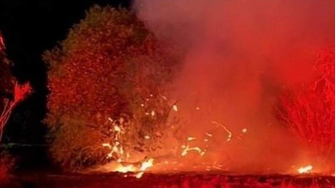 A vegetation fire burns near the Oakdale Rodeo Grounds on Saturday night, June 25, 2022. A battalion chief’s incident summary indicates it was sparked by a fireworks display that followed a concert at the rodeo grounds.