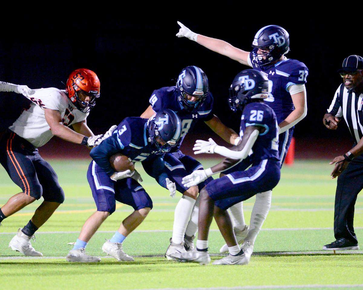 Downey’s Cody Pattee (3) recovers a fumble during a game between Downey High School and Merced High School at Downey High School in Modesto California on September 1, 2023.