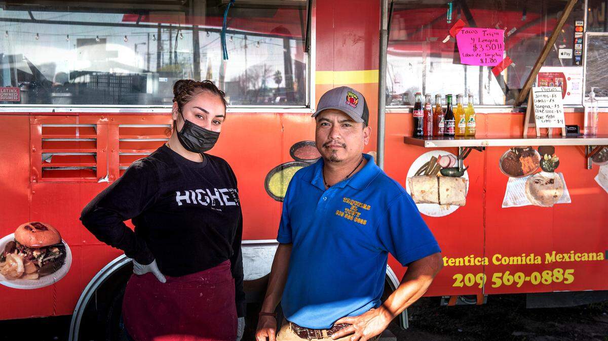 Antonio Hernandez, owner of Tacos El Tony, right, with his employee Jayleen Casillas, left, in Modesto, Calif., on Thursday, Jan. 27, 2022.