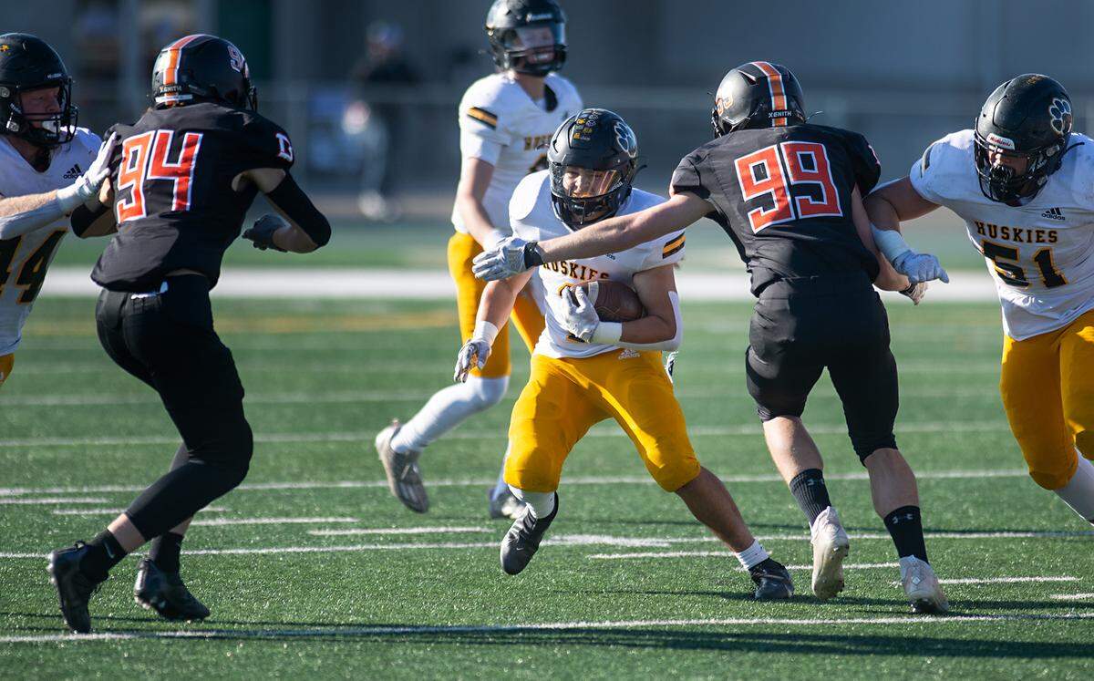 Hughson’s Alex Villarreal runs the ball during the Sac-Joaquin Section Division VI championship game with Summerville at St. Mary’s High School in Stockton, Calif., Saturday, Nov. 26, 2022.