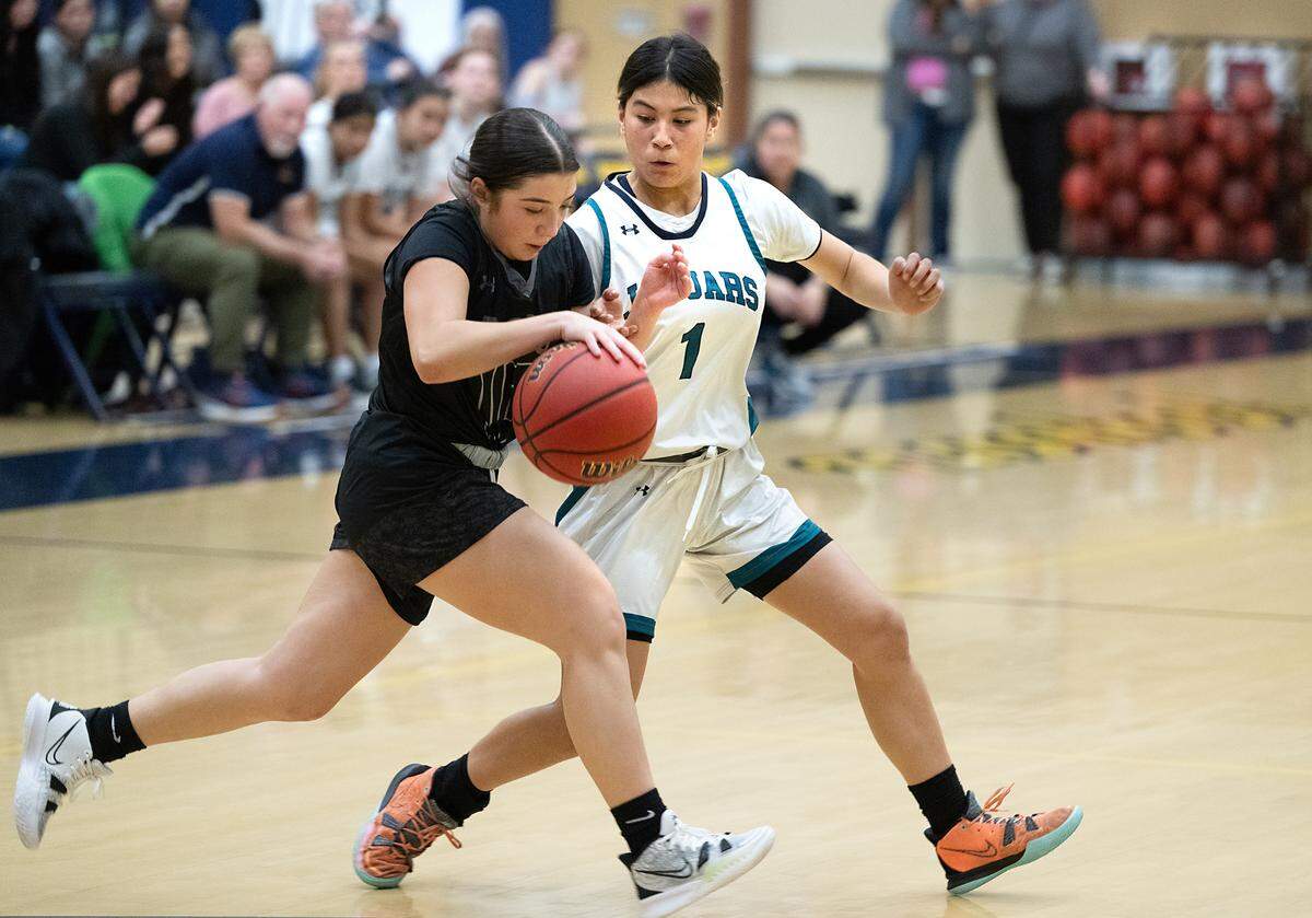 Gregori’s Lilly staggs defends on Tracy’s Gabriella Hernandez during the tournament game at Gregori High School in Modesto, Calif., Friday, Dec. 8, 2023.