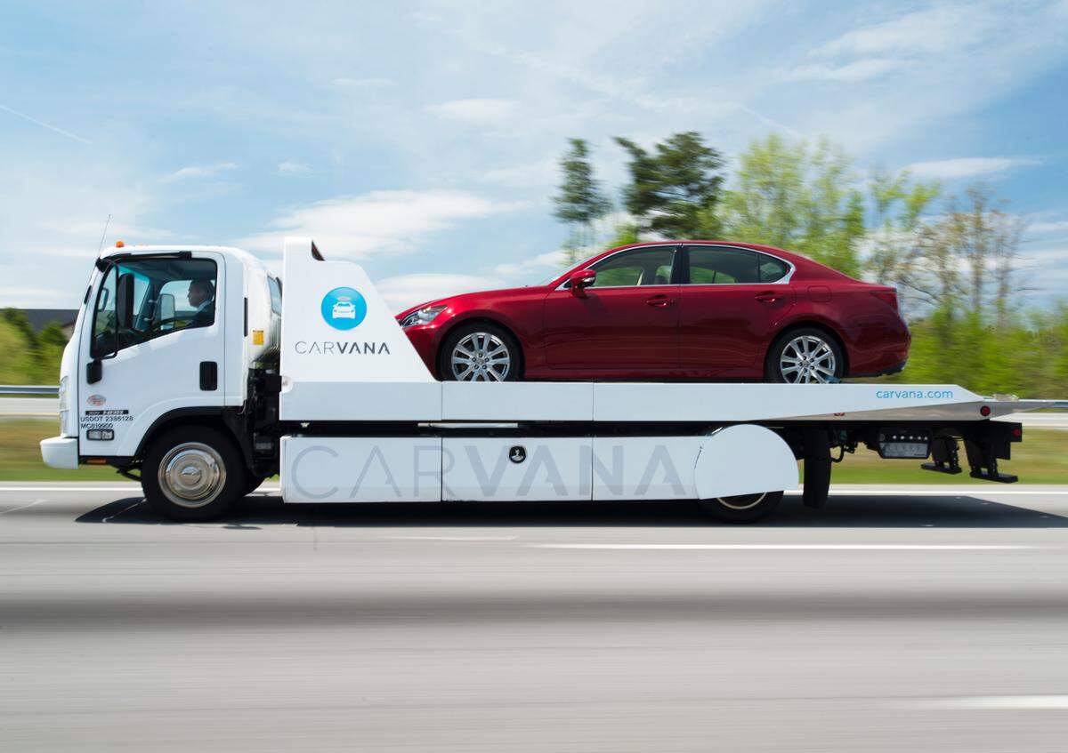 A car is shipped to its seller using Carvana, an online used car service.
