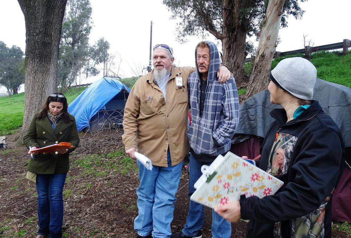 In this photo from January 2016, Randy Limburg of Telecare puts his arm around David Fuller, then 59 and staying in Beard Brook Park. Limburg and others were conducting the Point in Time Count, the annual homeless census. On July 19 at the State Theatre, after a screening of the documentary “Homeless in Modesto,” Fuller will take part in a panel discussion on homelessness.