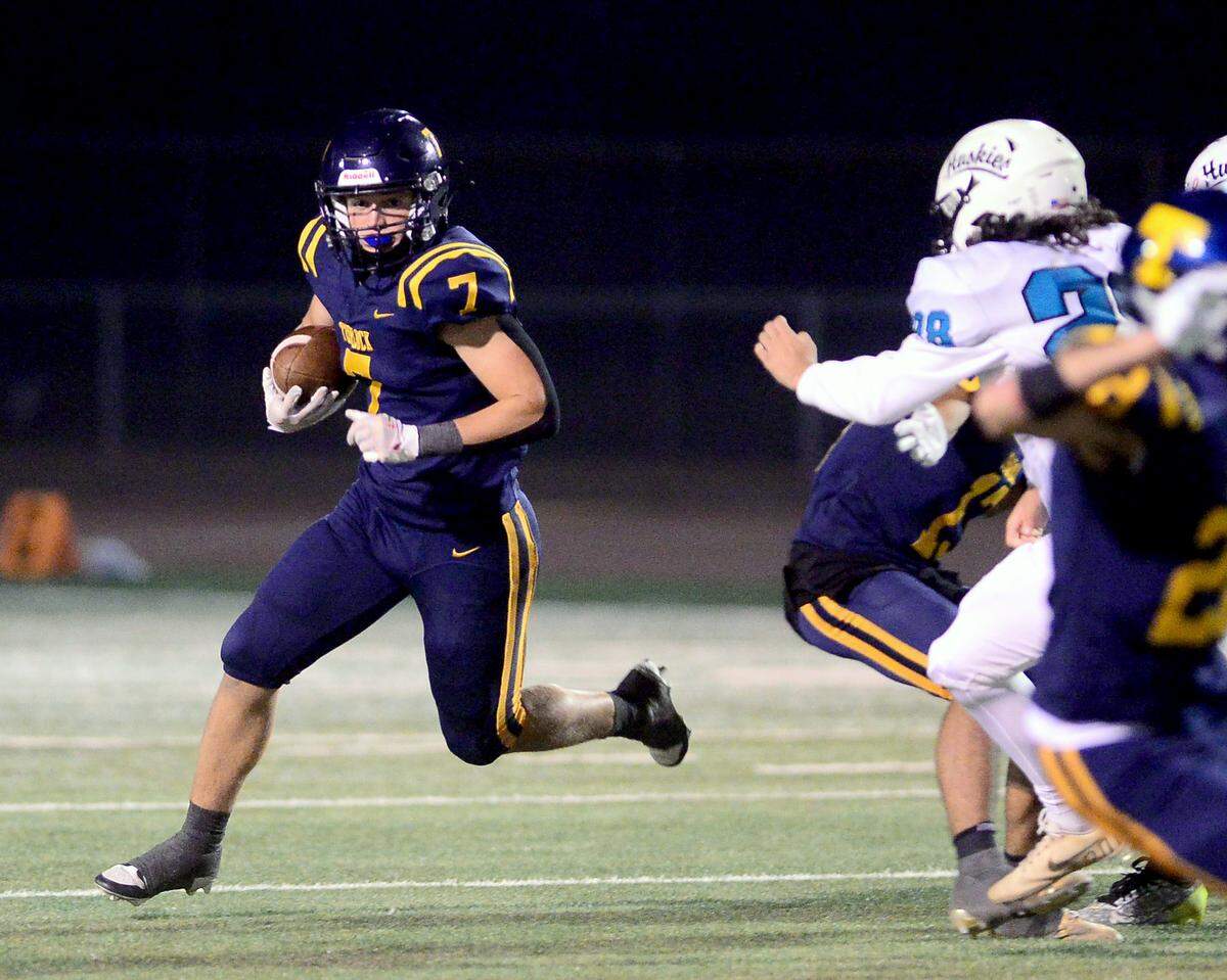 Turlocks Dayne Hart (7) returns a kick during a CIF Sac-Joaquin Section Football Division I playoff game between Turlock High School and Sheldon High School at Turlock High School in Turlock, California on Nov. 3, 2023.