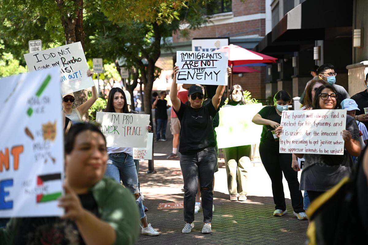 Protesters gather at 10th Street Plaza in Modesto, CA on the morning of Saturday, June 14, 2025 as part of the “No Kings” protests planned nationwide.