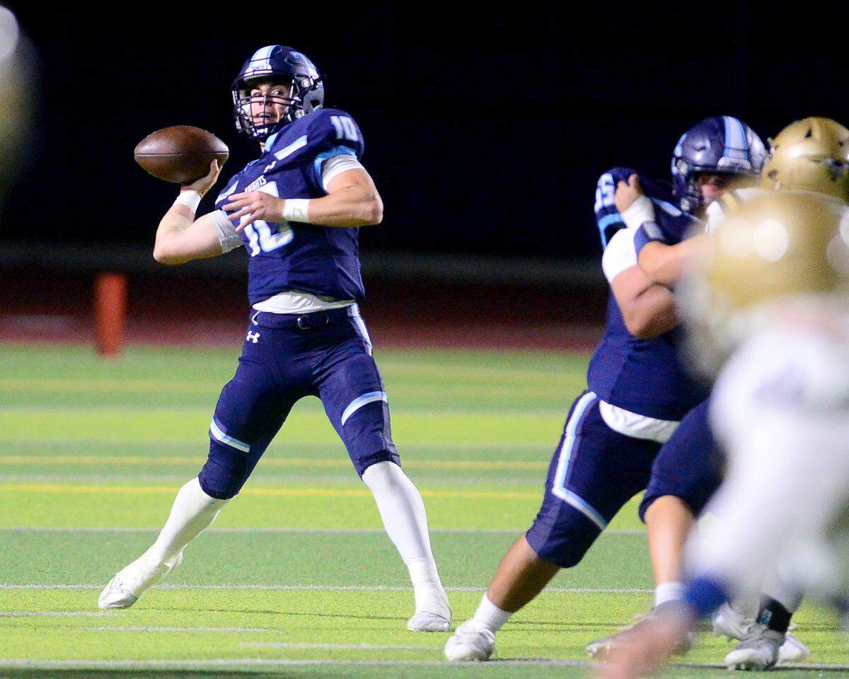 Downey quarterback Carson Lamb (10) throws a deep pass during a game between Downey High School and Elk Grove High School at Downey High School in Modesto, Calif. on August 30, 2024.