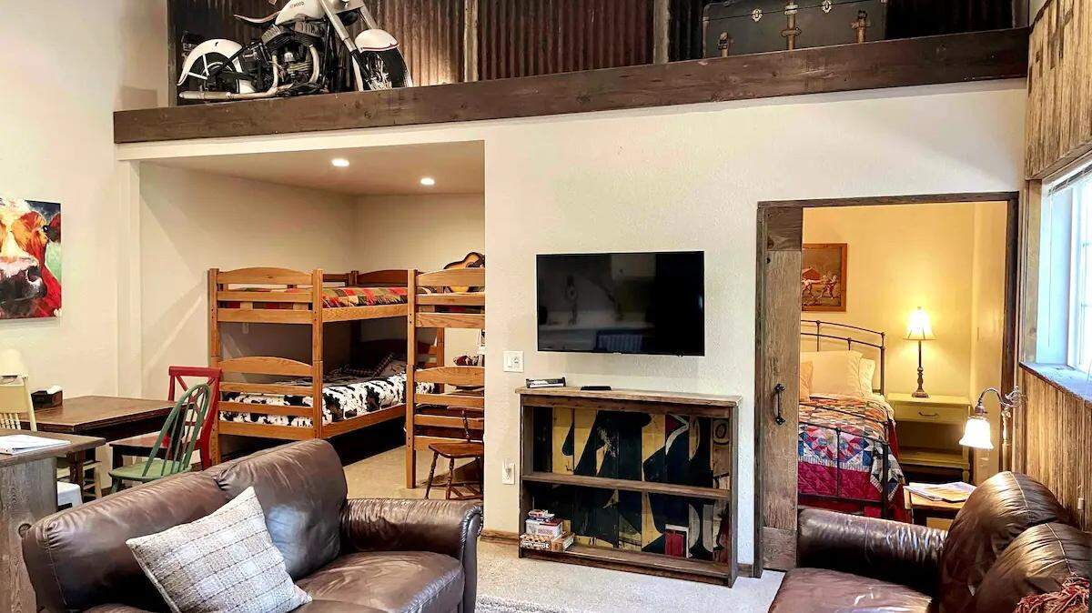 An antique motorcycle with parts cobbled together seven decades ago by Modesto’s Fred C. Atwood, including a 1945 Harley-Davidson engine, is displayed on a 9-foot ledge inside an Airbnb rental in Shingle Springs, Calif.