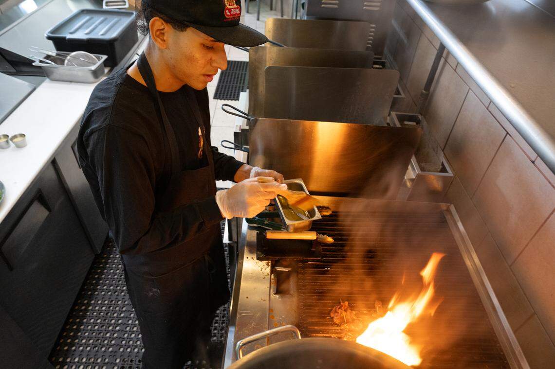 Cook Aaron Quijandria grills Peruvian anticuchos at Al Carbon restaurant in Modesto, Tuesday, Nov. 5, 2024.