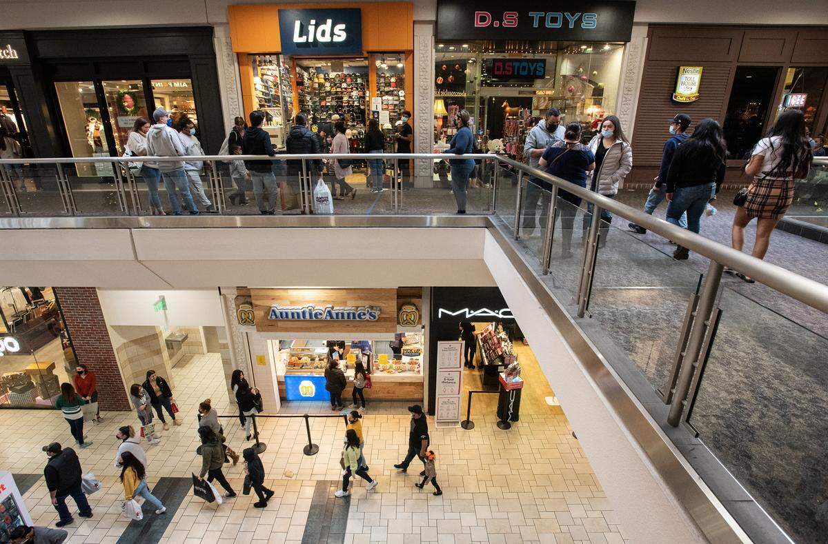 People shop at Vintage Faire Mall in Modesto, Calif., on Friday, Nov. 27, 2020.