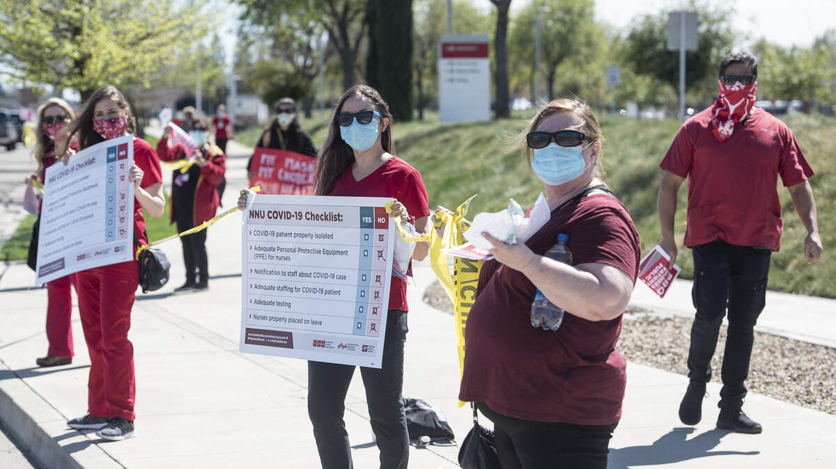 Nurses and hospital workers protest out front of Kaiser Medical Center over lack of personal protective equipment for nurses and other hospital workers dealing with coronavirus pandemic in Modesto, Calif., on Tuesday, March 31, 2020.  