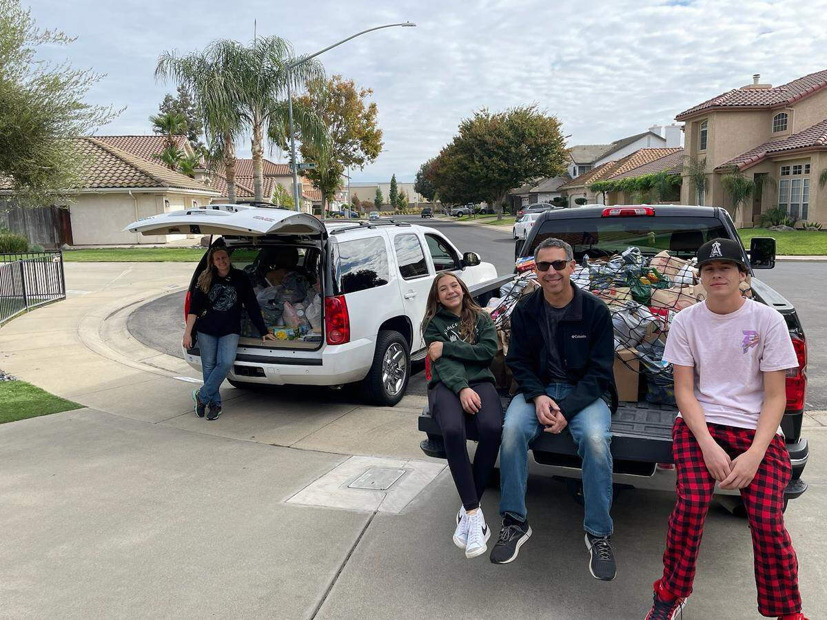 10 years later, the Knobel family, pictured, hasn’t stopped their annual food drive. Last year, they brought in 25,000 pounds of food.