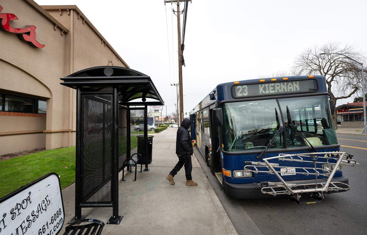 A rider boards a StanRTA bus on McHenry Avenue in Modesto, Calif., Thursday, Jan. 9, 2024.