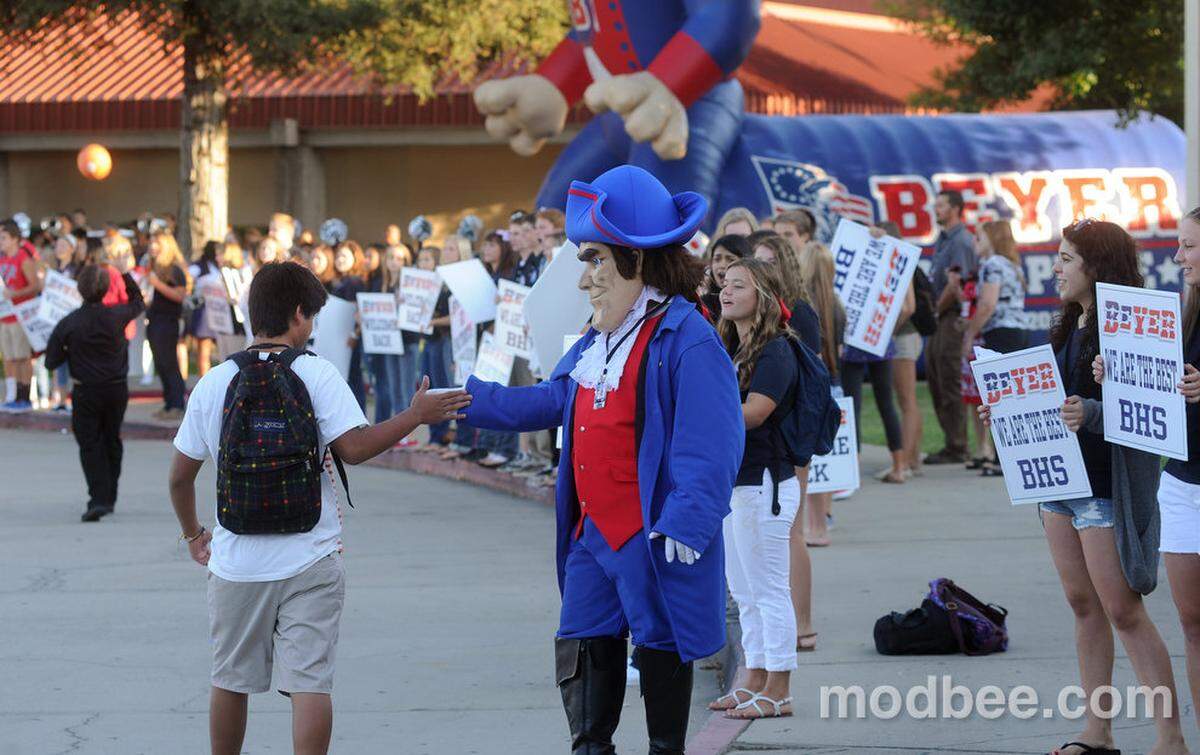 Beyer High School’s patriot mascot greets students arriving on campus for the first day of school Thursday morning (08-08-13).