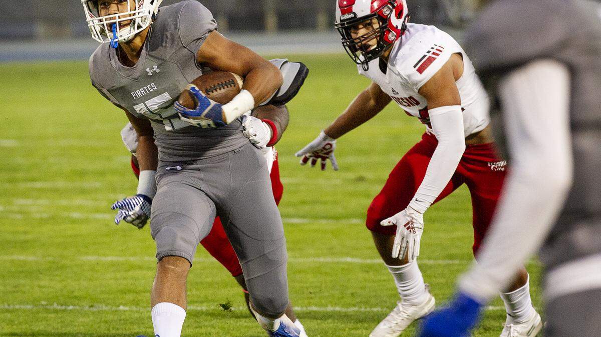 Modesto’s Payton Bass runs the ball during the Valley League game with Fresno at Modesto Junior College in Modesto, Calif., Saturday, Nov. 2, 2019.