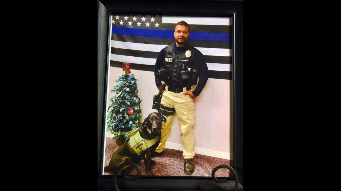 Newman Police officer Ronil Singh and his dog Sam are pictured in a photo supplied by the Newman Police Department Thursday morning December 27, 2018 at a press conference in Newman, Calif. Singh was killed during a traffic stop in Newman on December 26, 2018.