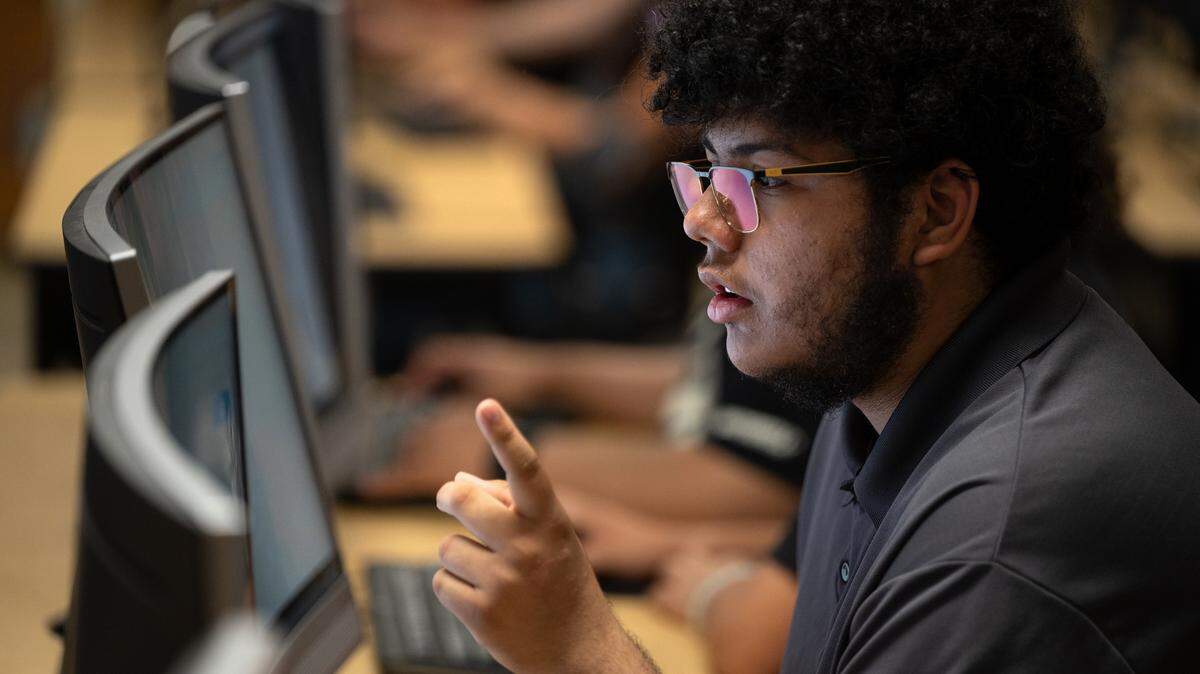 Enochs junior Ryan Stead works on a cybersecurity challenge during a computer science Hackathon at Enochs High School in Modesto, Calif., Saturday, May 11, 2024.