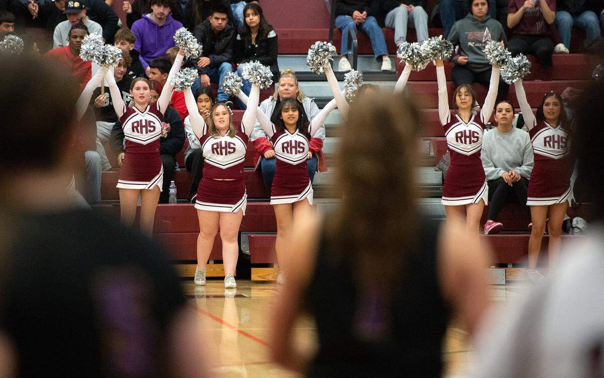 Riverbank cheer team during the Sac-Joaquin section semifinal playoff game with Escalon in Riverbank, Calif., Tuesday, Feb. 21, 2023. The Riverbank girls basketball team advanced to play Colfax in the Division IV section final after beating TVL rival Escalon 58-41 in the semifinals.