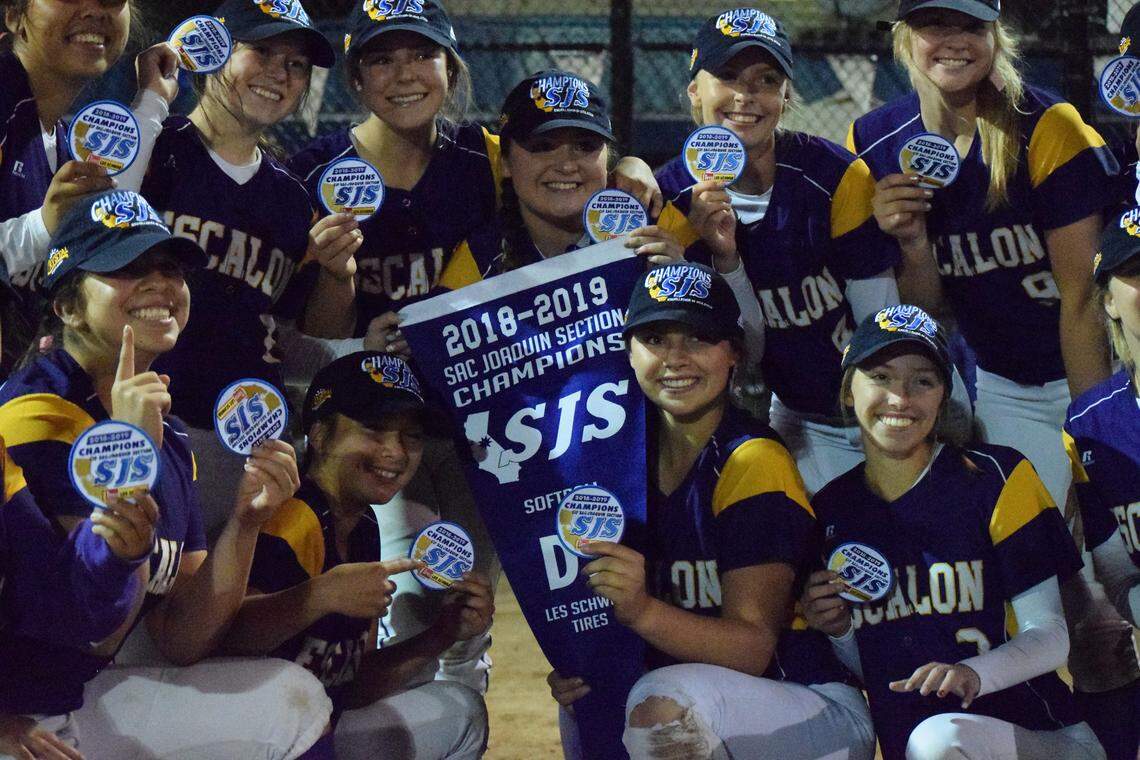 Escalon softball players receive their patches and a banner after a 11-6 win over Linden in the CIF Sac-Joaquin Section Division V Championship on Tuesday, May 21, 2019 at the Arnaiz Softball Complex in Stockton, California.