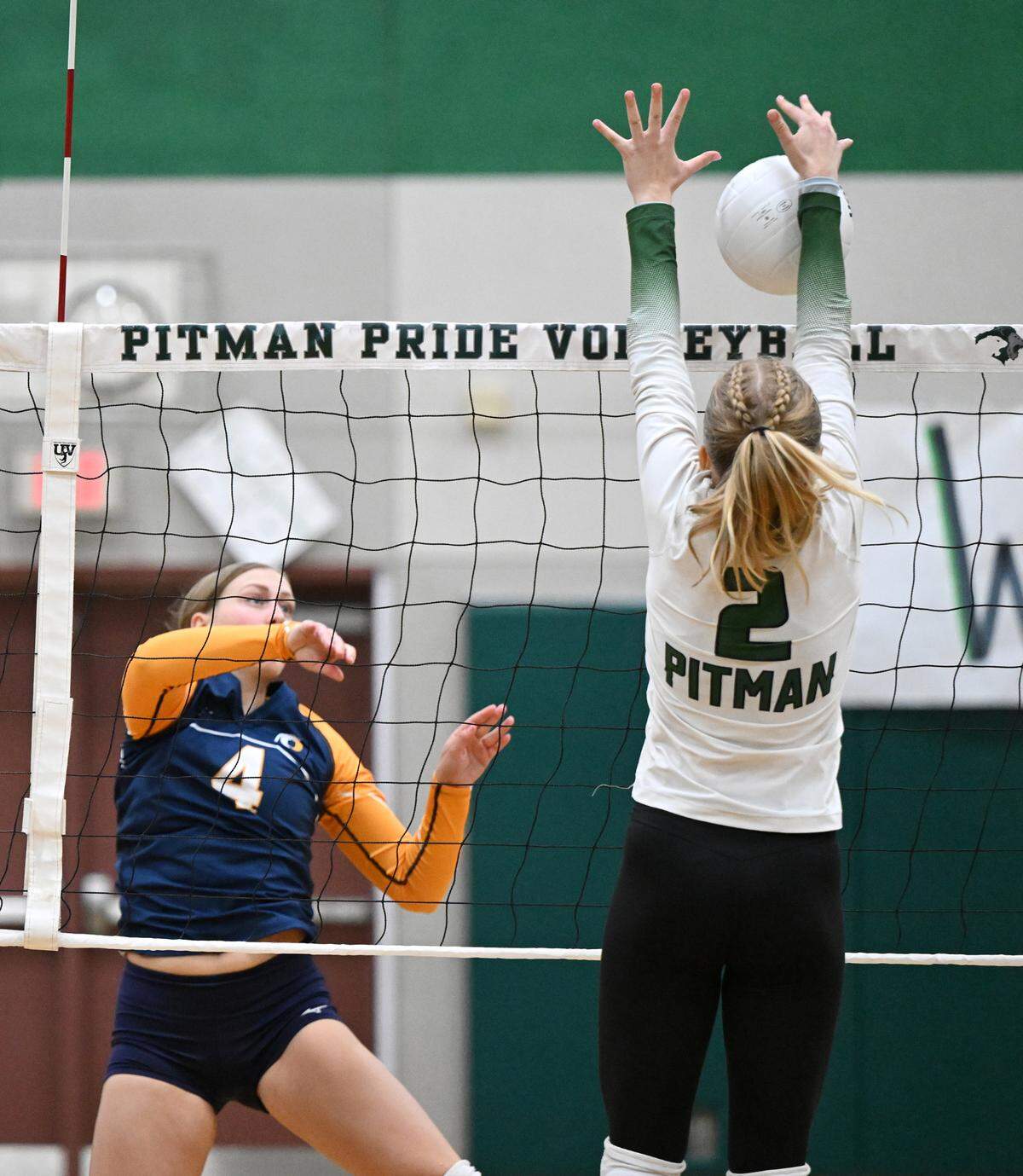 Pitman’s Aila Reich blocks the ball from Oak Ridge’s Kylie Gaunt during the non-league match at Pitman High School in Turlock, Calif., Thursday, September 7, 2023.