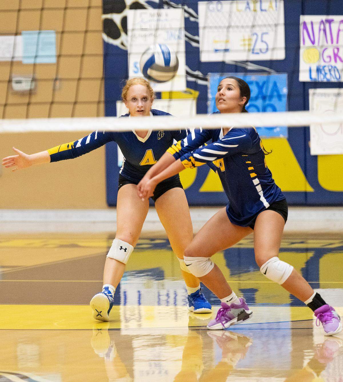 Gregori’s Olivia Lucas returns a serve in front of teammate Sydney Rogers during the Central California Athletic League match with Downey at Gregori High School in Modesto, Calif., Thursday, Sept. 19, 2024. Downey won the match 3-2.