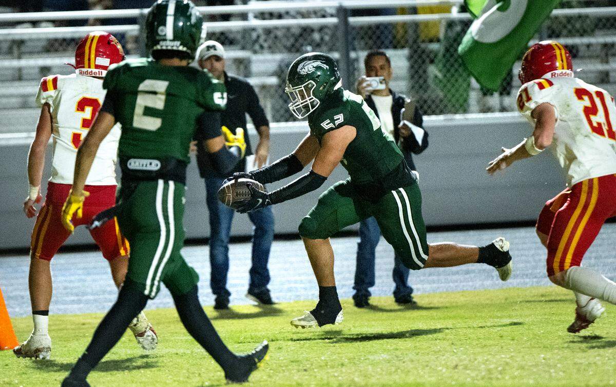 Manteca’s Kyrin Barajas runs the ball into the end zone during the Valley Oak League game with Oakdale at Manteca High School in Manteca, Friday, Nov. 1, 2024.