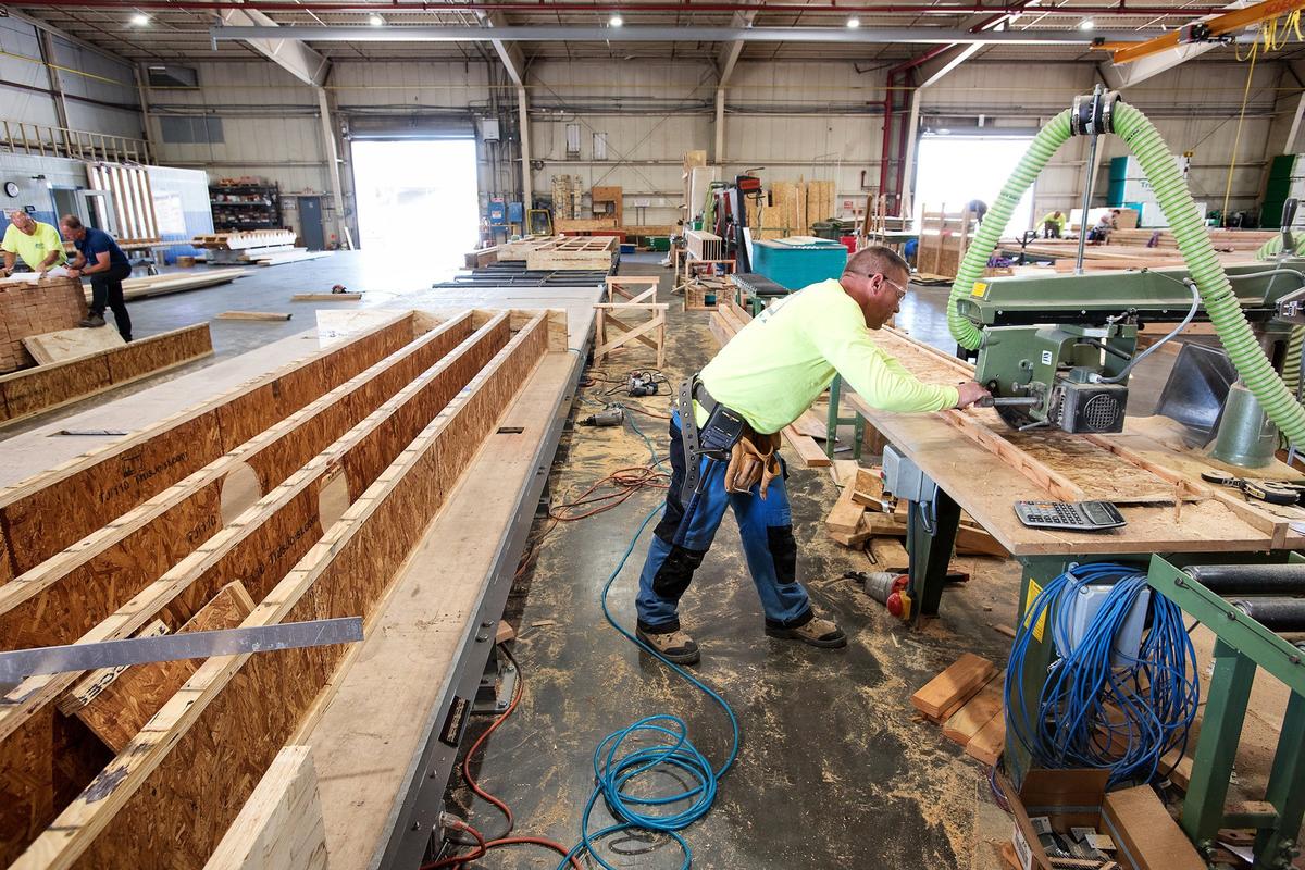 Colm McErlain cuts section for a floor panel at the Entekra manufacturing facility in Ripon, Calif., Thursday, May 24, 2018.
