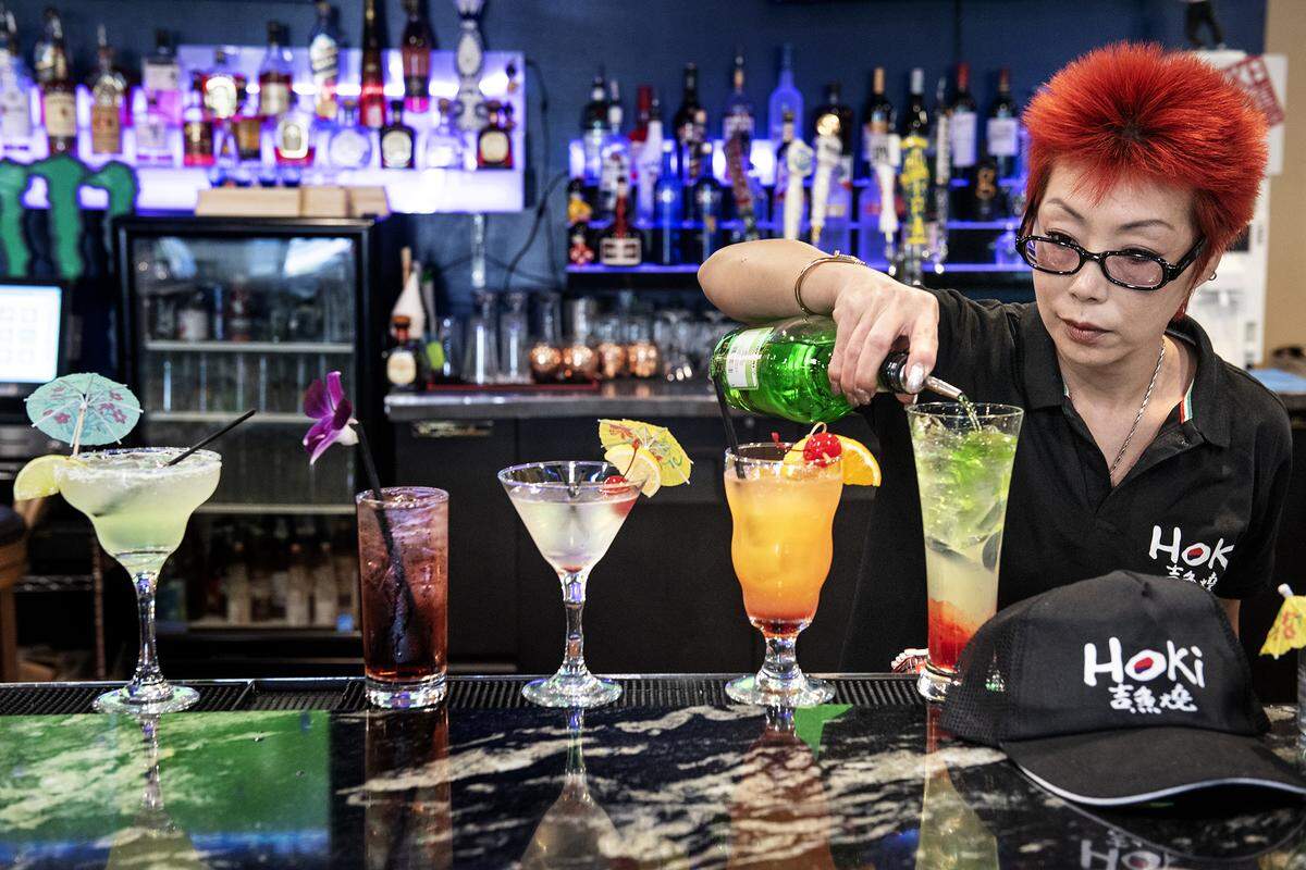 Co-Owner Annie Chang makes creates some mixed drinks at Hoki Korean BBQ & Japanese Cuisine on Coffee Road in Modesto, Calif., Wednesday, Oct. 23, 2019.