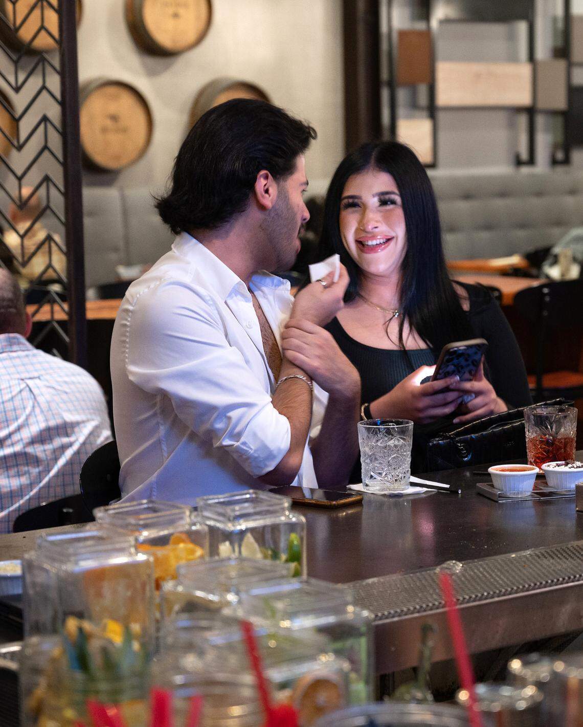 Noemi Soria and Macario Aguilar enjoy a drink at at Memo’s Cocina and Tequila Bar in Turlock, Calif., Friday, Jan. 20, 2023.