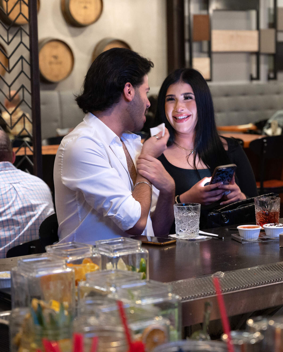 Noemi Soria and Macario Aguilar enjoy a drink at at Memo’s Cocina and Tequila Bar in Turlock, Calif., Friday, Jan. 20, 2023.