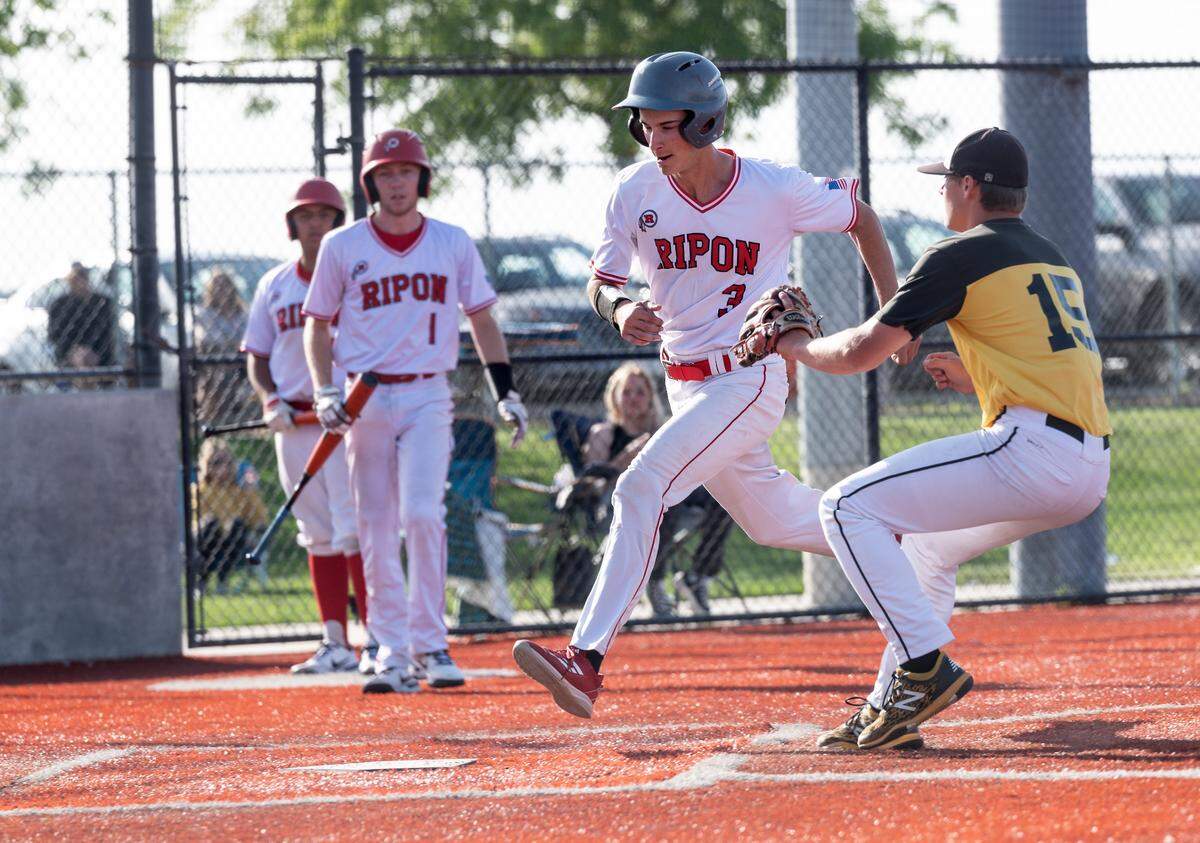 Ripon’s Branden Molthen beats the throw on a pass ball to score the winning run during the Trans Valley League game with Hughson at Mistlin Park in Ripon, Calif., on Wednesday, April 27, 2022. Ripon won the game 11-1.